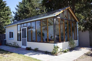 A exterior view of the greenhouse focusing on the main sunroom.