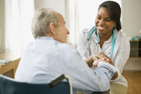 A home care worker checks in on a patient.  Image by Myfuture.com, licensed via CC BY-ND 2.0.