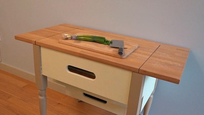 The secretarial desk closes down to be at standard table height with a usable top surface.